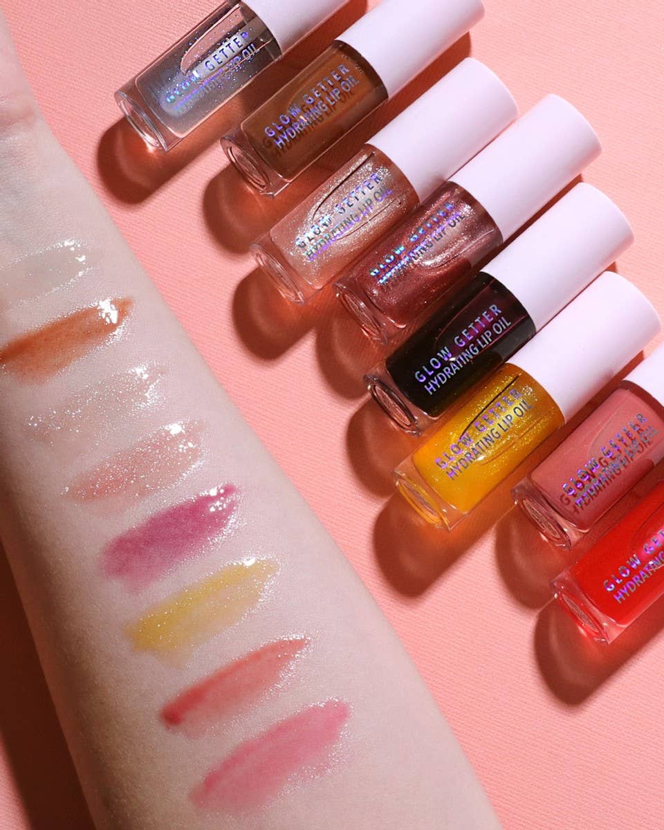 Set of lip glosses with swatches 