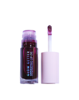 Lip oil with applicator on a white background