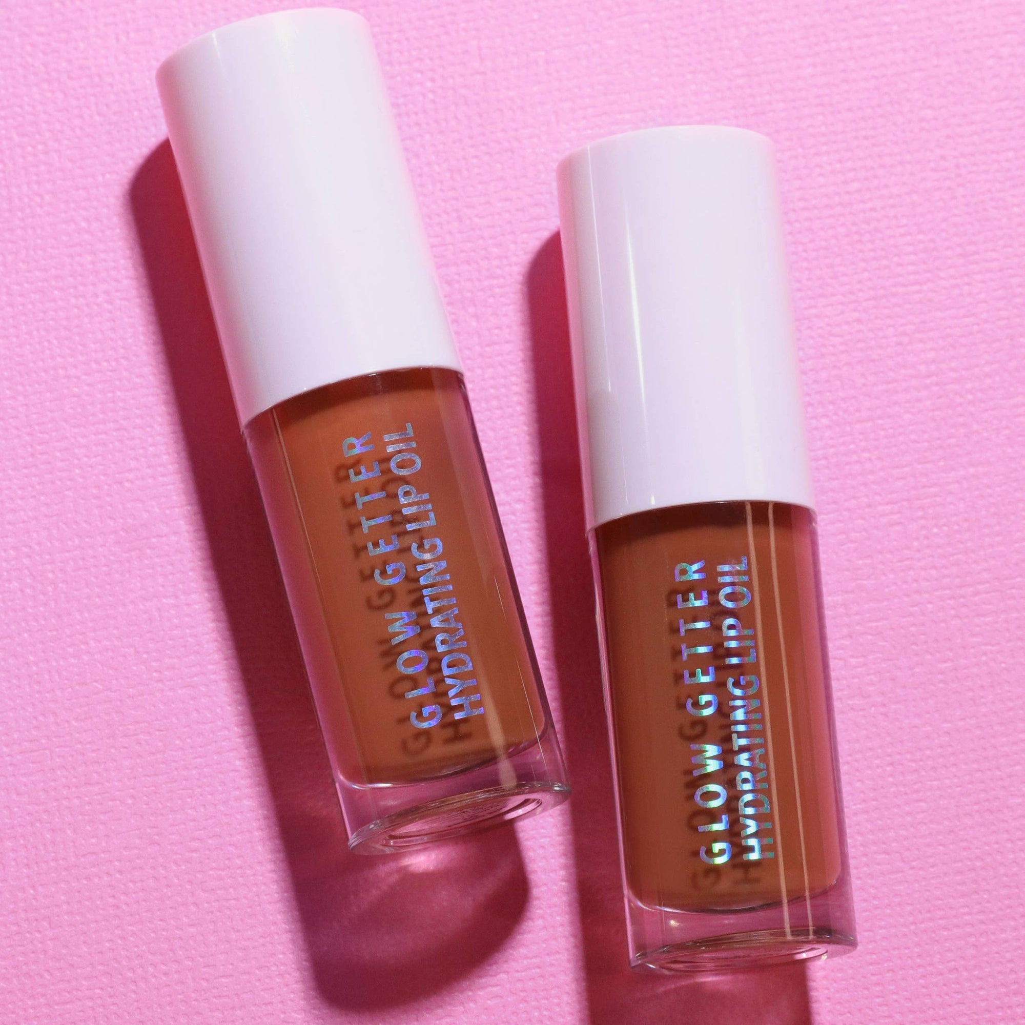 Two lip gloss bottles labeled 'Glow Getter' 