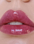 Close-up of glossy pink lips 