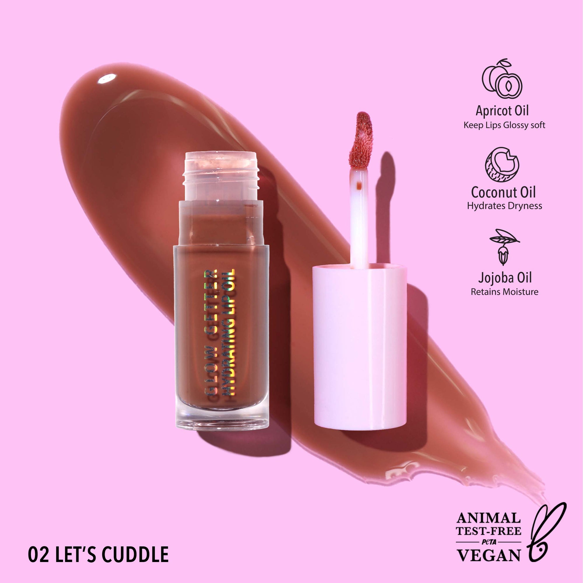 Lip gloss with applicator on a pink background, featuring ingredients and vegan 